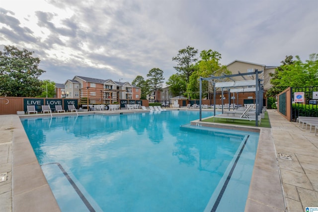 view of swimming pool with a pergola and a patio area