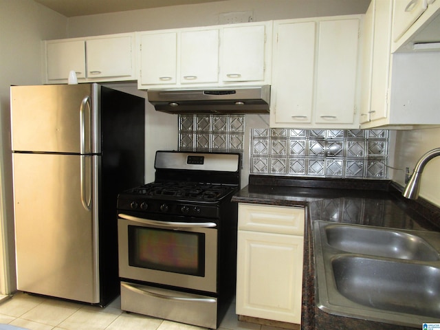 kitchen featuring exhaust hood, white cabinets, sink, light tile patterned floors, and stainless steel appliances