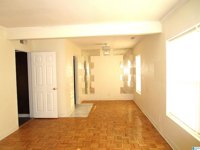 empty room with light parquet floors and ornamental molding