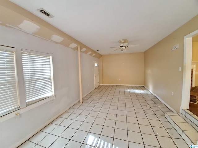 unfurnished room with light tile patterned flooring and ceiling fan