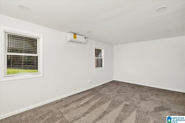 carpeted empty room with a wall unit AC