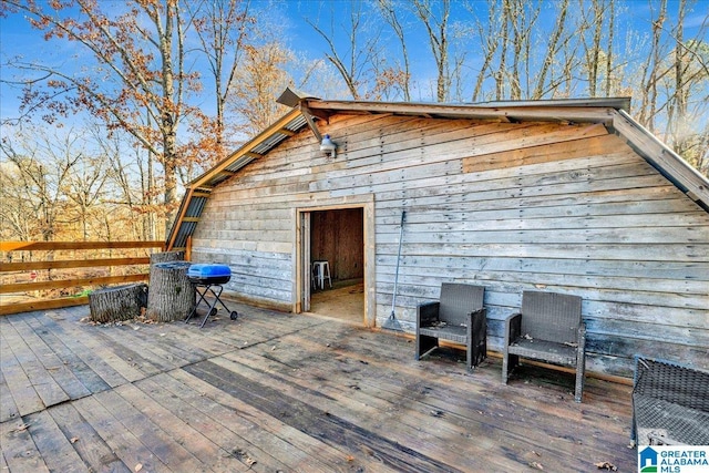 view of patio / terrace featuring a wooden deck and area for grilling