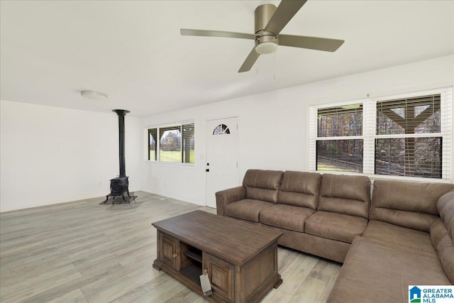 living room with ceiling fan and light hardwood / wood-style floors