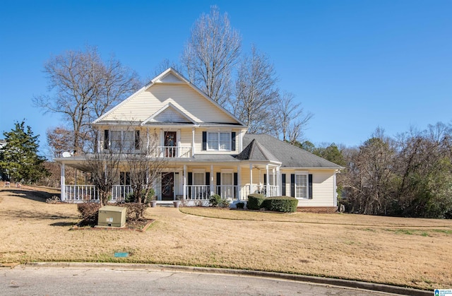 view of front of home featuring covered porch and a front lawn