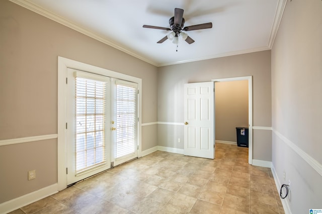 empty room featuring ceiling fan, crown molding, and french doors