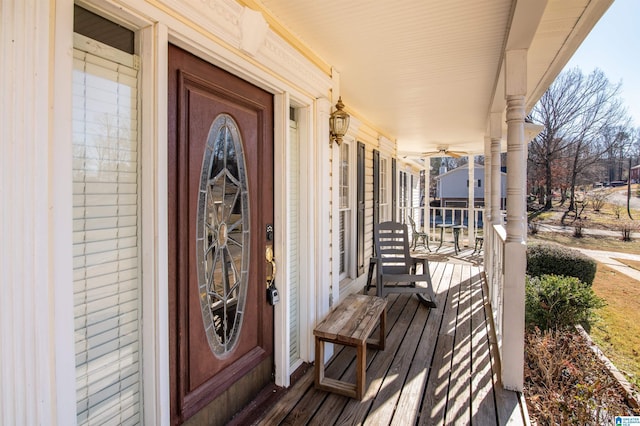 view of exterior entry with covered porch