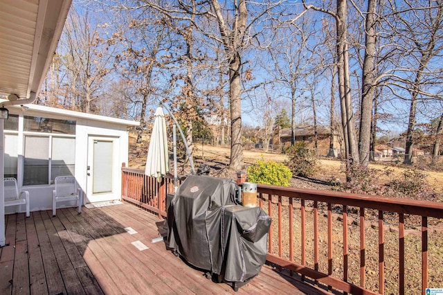 deck featuring grilling area and a sunroom