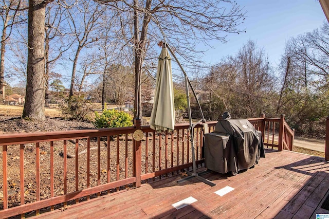 wooden deck with grilling area