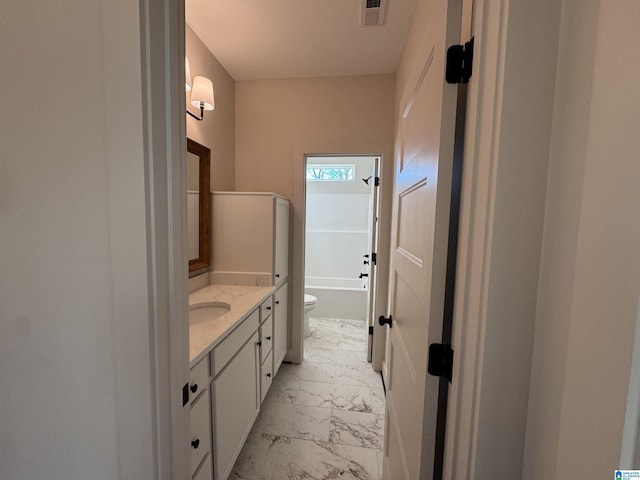 bathroom with vanity and toilet