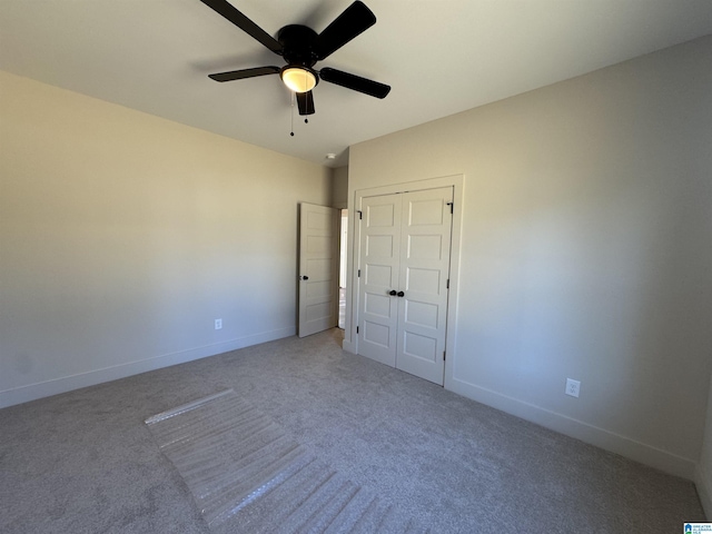 unfurnished bedroom featuring carpet and ceiling fan