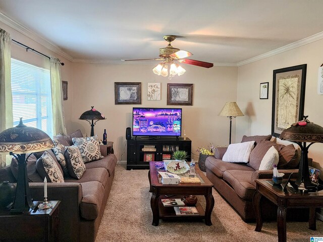 living room with ceiling fan, light colored carpet, and ornamental molding