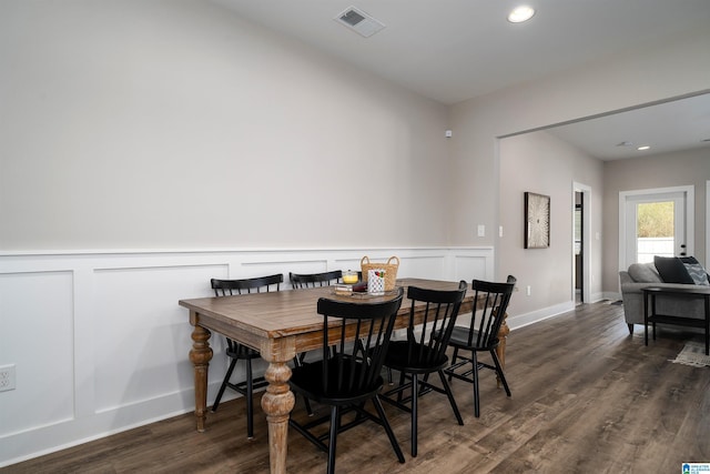 dining space featuring dark wood-type flooring