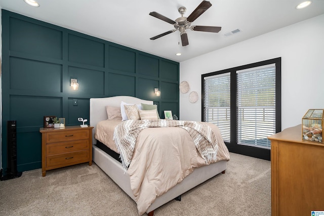 bedroom featuring light carpet and ceiling fan