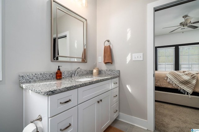 bathroom featuring vanity, tile patterned floors, and ceiling fan