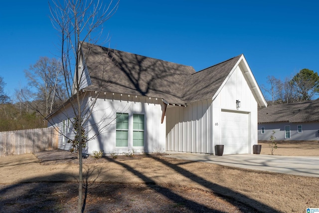 view of side of home with a garage