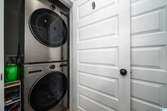 laundry area featuring stacked washing maching and dryer