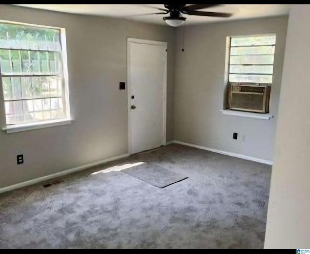 interior space with carpet flooring, ceiling fan, and a healthy amount of sunlight