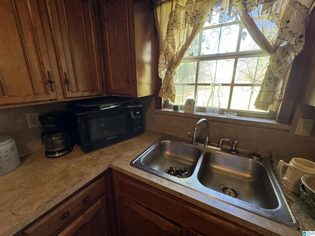 kitchen with plenty of natural light and sink