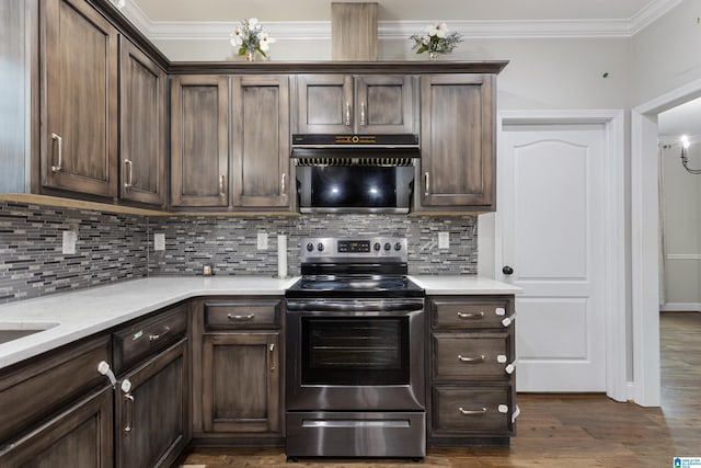 kitchen with crown molding, stainless steel electric stove, dark wood-style floors, and dark brown cabinets