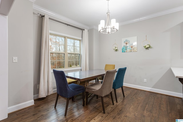 dining room featuring wood finished floors, baseboards, and ornamental molding