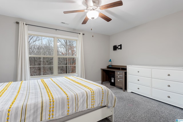 carpeted bedroom featuring visible vents and ceiling fan