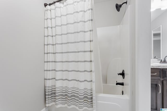 full bathroom featuring vanity and shower / tub combo with curtain