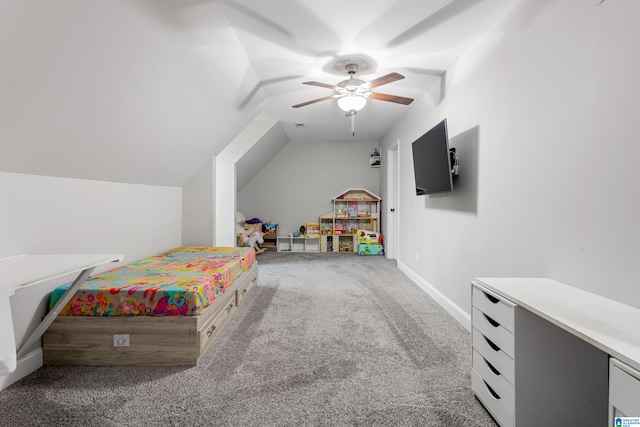 carpeted bedroom with lofted ceiling, a ceiling fan, and baseboards