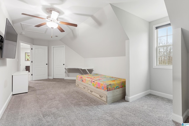 bedroom featuring lofted ceiling, carpet flooring, a ceiling fan, and baseboards