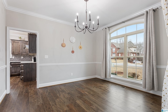 unfurnished dining area featuring visible vents, plenty of natural light, dark wood-type flooring, and ornamental molding