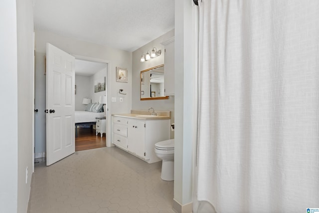 bathroom featuring vanity and a textured ceiling