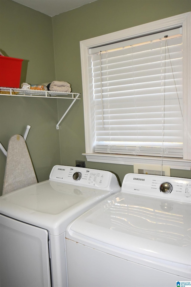 laundry area with washing machine and dryer