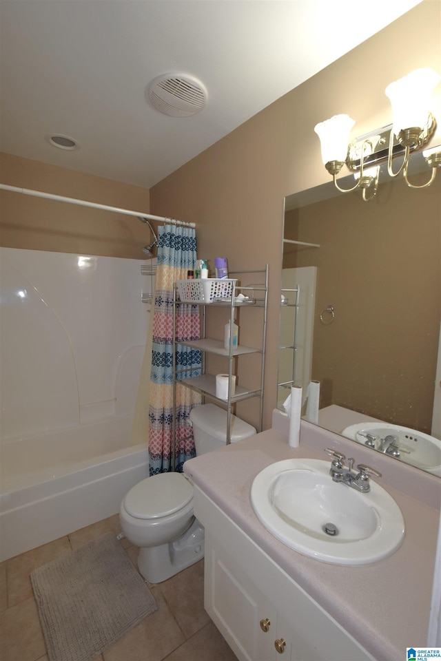 full bathroom with an inviting chandelier, tile patterned floors, toilet, shower / bath combo with shower curtain, and vanity