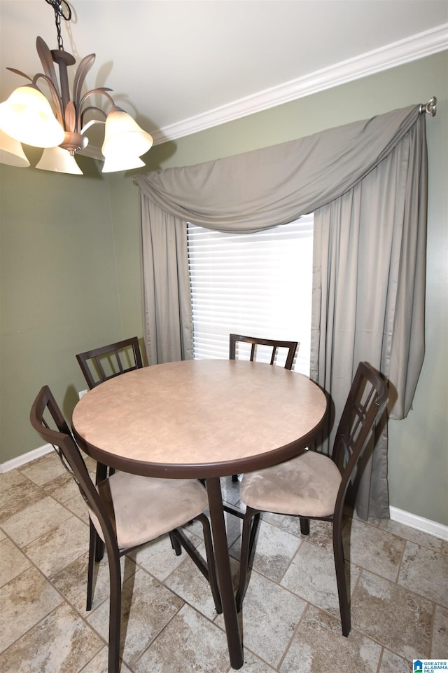 dining space featuring crown molding and a notable chandelier