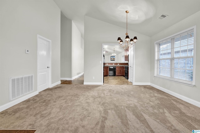 unfurnished living room with light carpet, lofted ceiling, and a notable chandelier