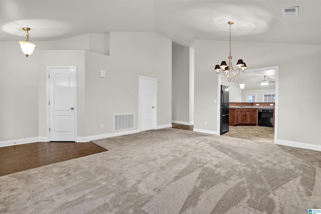 unfurnished living room with carpet flooring, ceiling fan with notable chandelier, and lofted ceiling