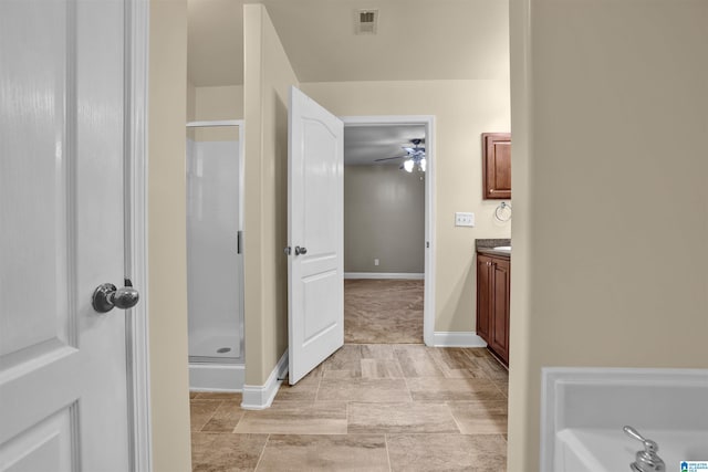 bathroom with ceiling fan, vanity, and an enclosed shower