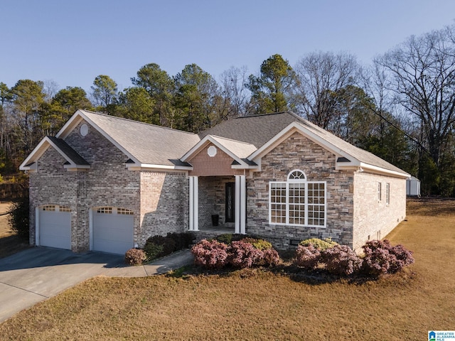 view of front of house with a front yard and a garage