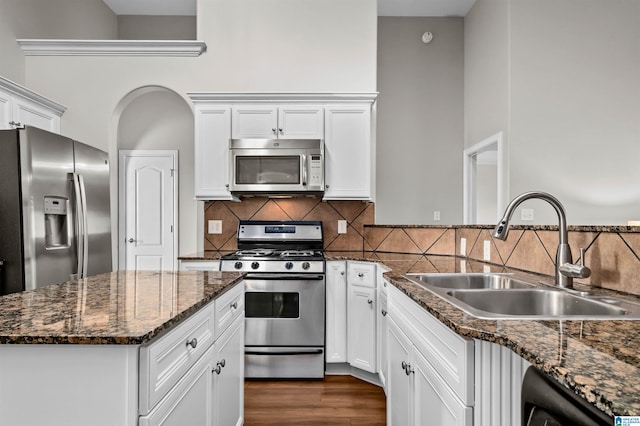 kitchen with sink, white cabinets, and stainless steel appliances