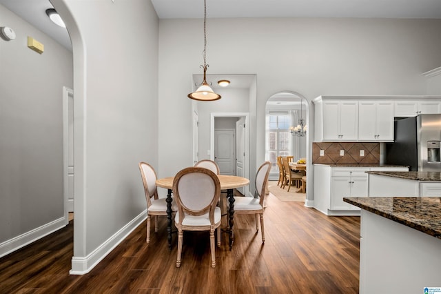 dining area with dark wood-type flooring