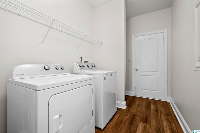 washroom featuring dark hardwood / wood-style floors and independent washer and dryer