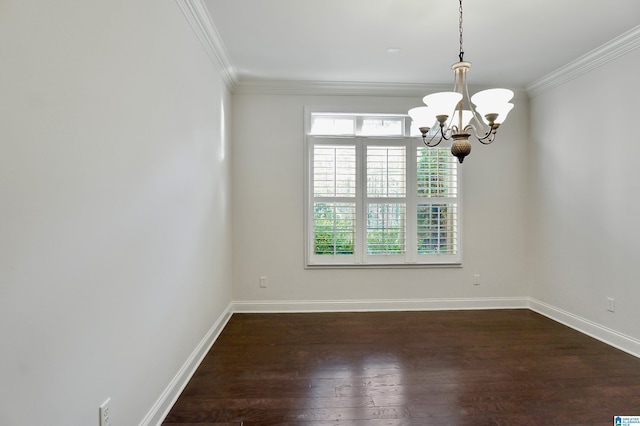 empty room with a notable chandelier, dark hardwood / wood-style flooring, and crown molding