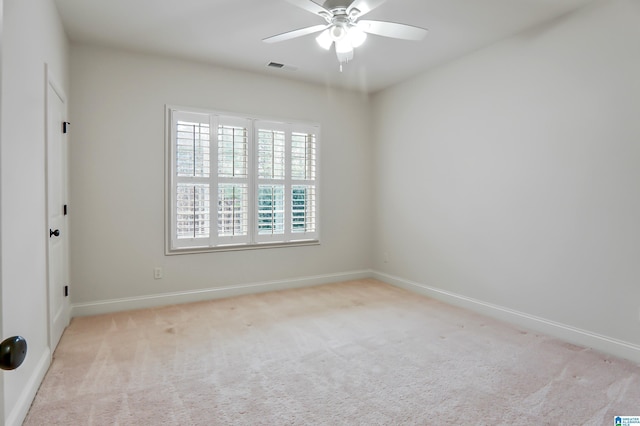 carpeted empty room with ceiling fan