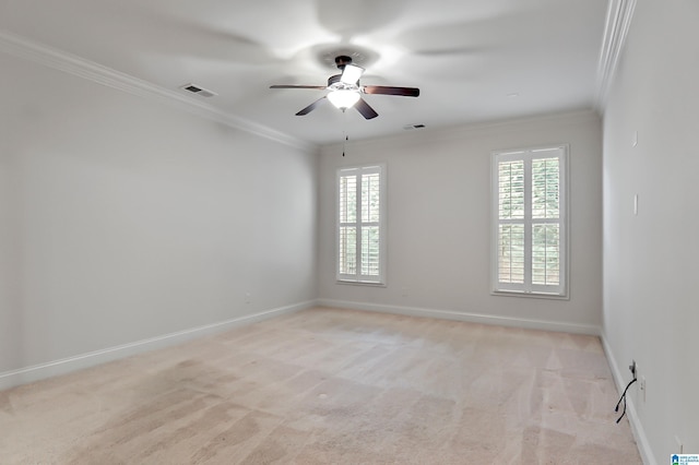 carpeted empty room with ornamental molding and ceiling fan