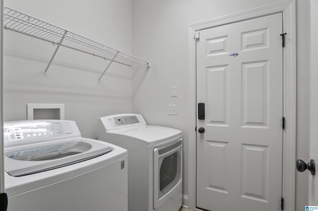 laundry room featuring washer and clothes dryer