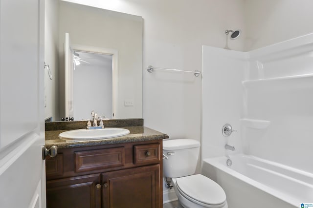 full bathroom with toilet, vanity, ceiling fan, and bathing tub / shower combination