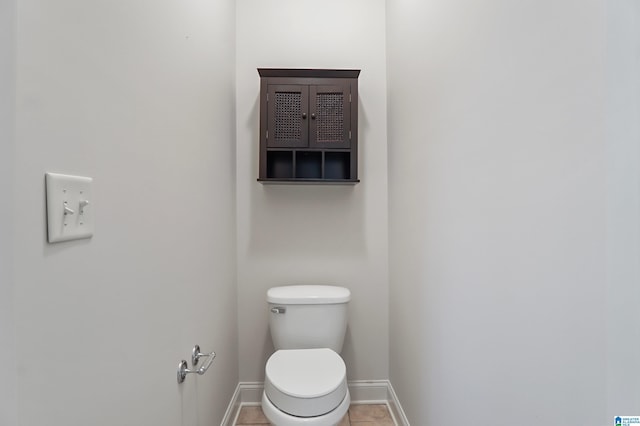 bathroom featuring tile patterned flooring and toilet