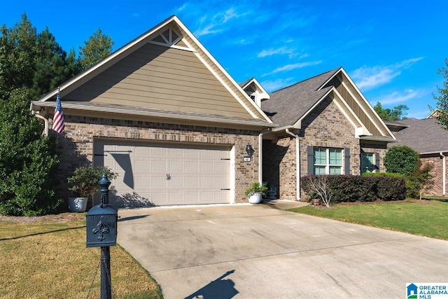 craftsman house with a garage and a front lawn