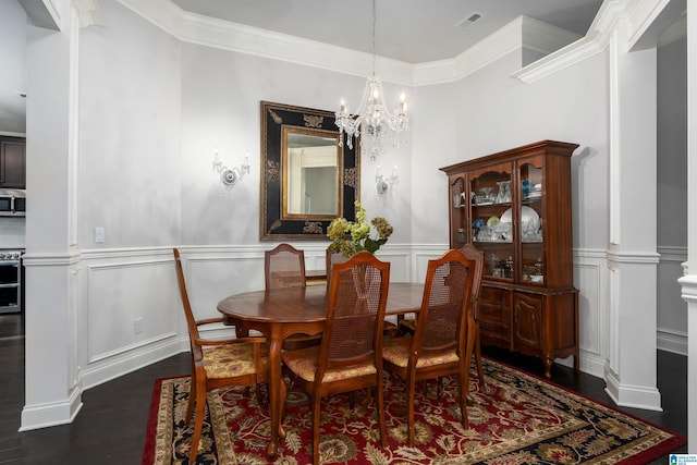 dining room with a chandelier, dark hardwood / wood-style floors, and ornamental molding