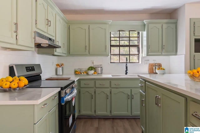 kitchen with decorative backsplash, dark hardwood / wood-style floors, sink, and stainless steel range