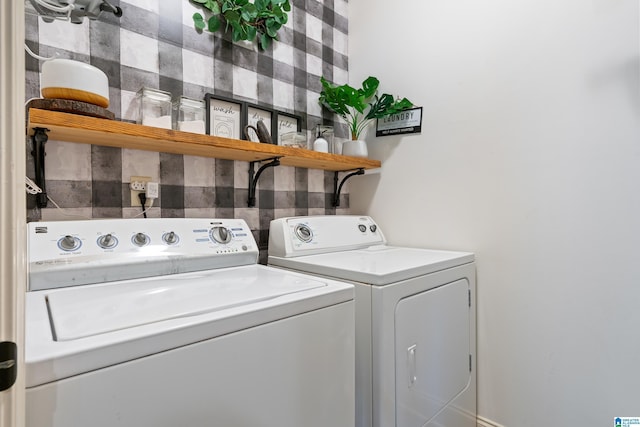 clothes washing area featuring washing machine and dryer